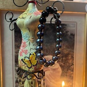 Black beaded bracelet.